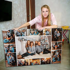 Woman posing with a large photo collage of family and friends.